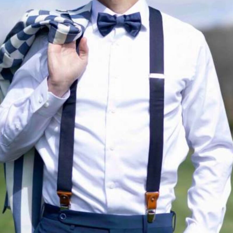 an image of a man wearing a pair of black suspenders to hold up his pants