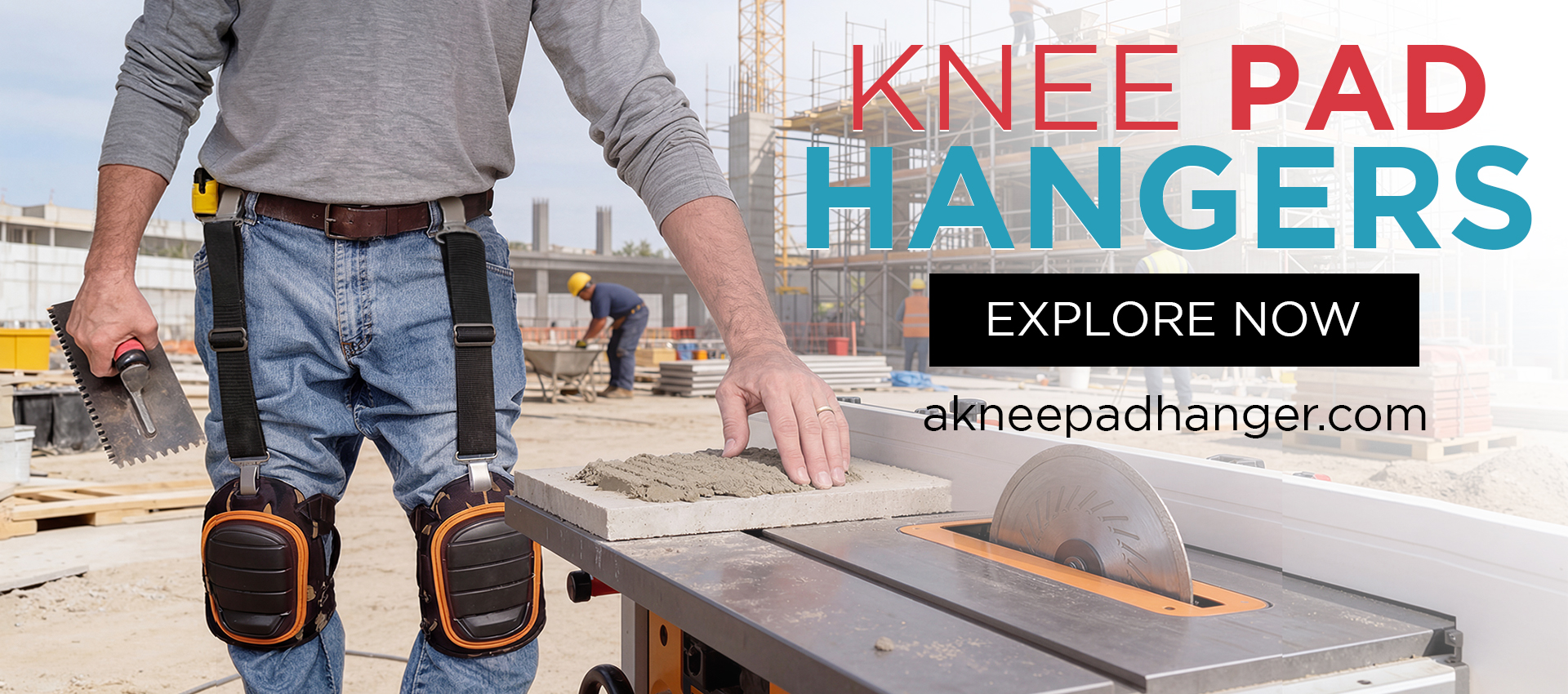 Tile installer standing outside on the jobsite by a tile saw holding a tile trowl wearing a pair of knee pad hangers to hold up his knee pads on the job.